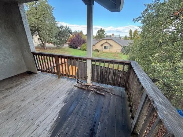 an empty room with a empty space and windows