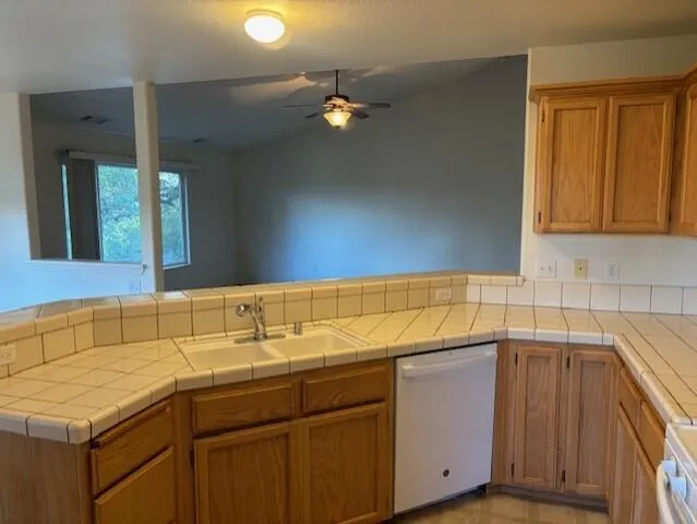 a kitchen with a sink and cabinets