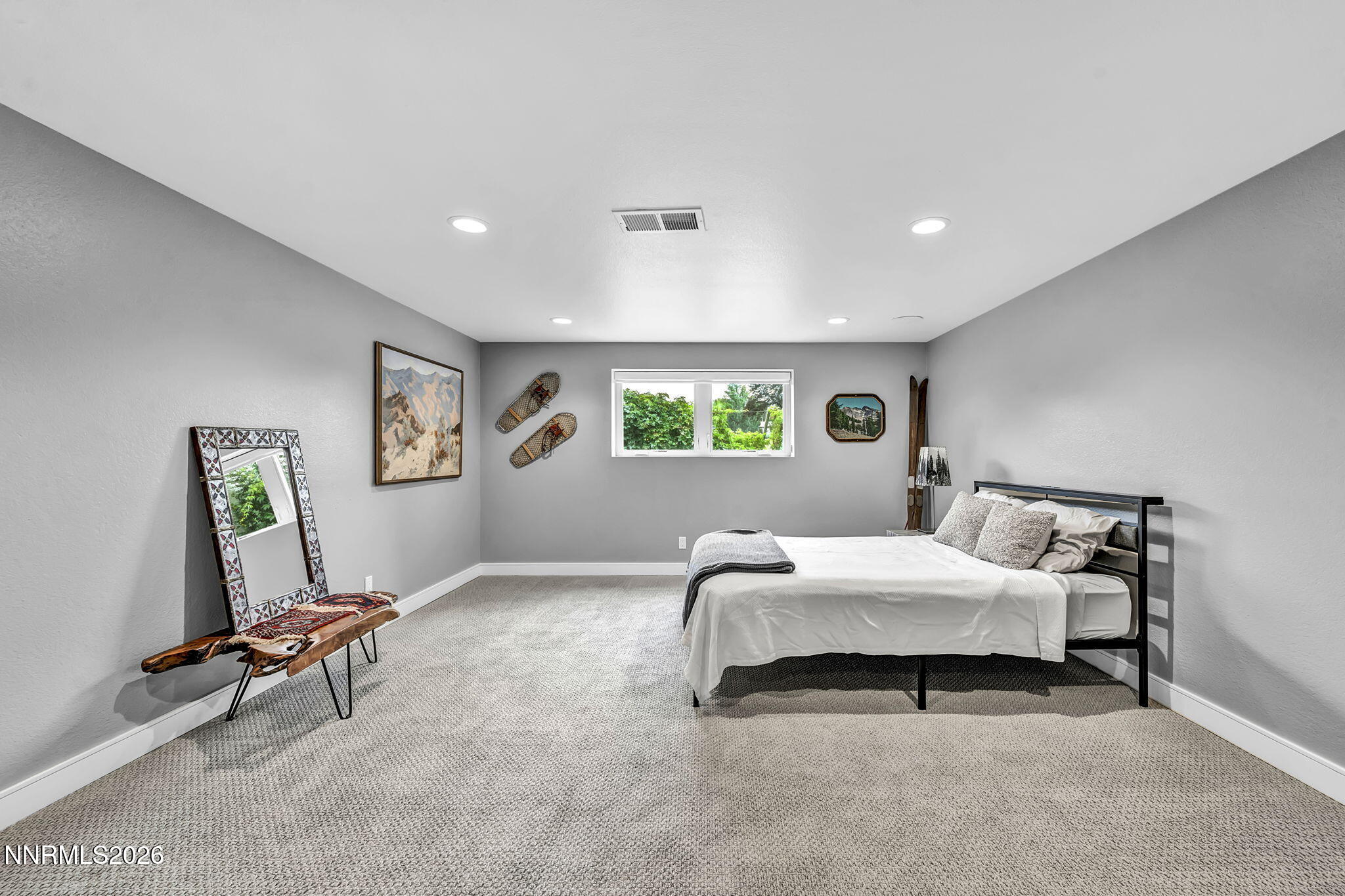 4865 Lakeridge Terrace West Reno, NV 89509 - Photo 37 of 51 a bedroom with a bed a desk and chair