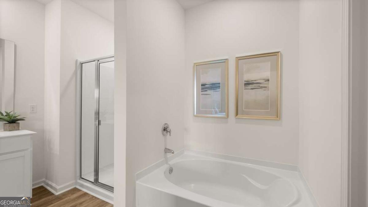 204 Cattle Drive Perry, GA 31069 - Photo 16 of 44 a white bath tub sitting next to a shower