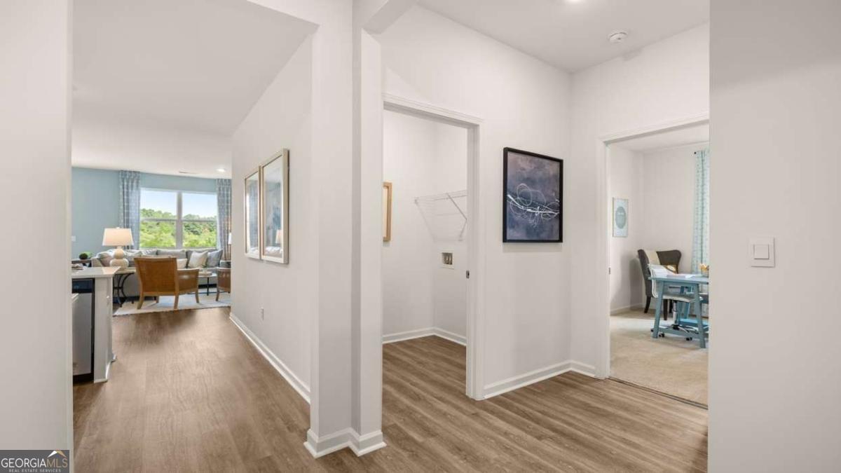 204 Cattle Drive Perry, GA 31069 - Photo 23 of 44 a view of a hallway to a livingroom and a livingroom with furniture
