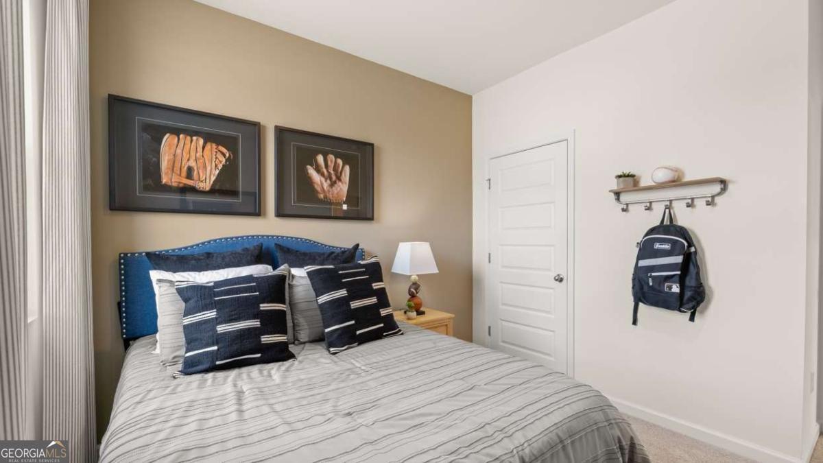 204 Cattle Drive Perry, GA 31069 - Photo 35 of 44 a bedroom with a bed and a table