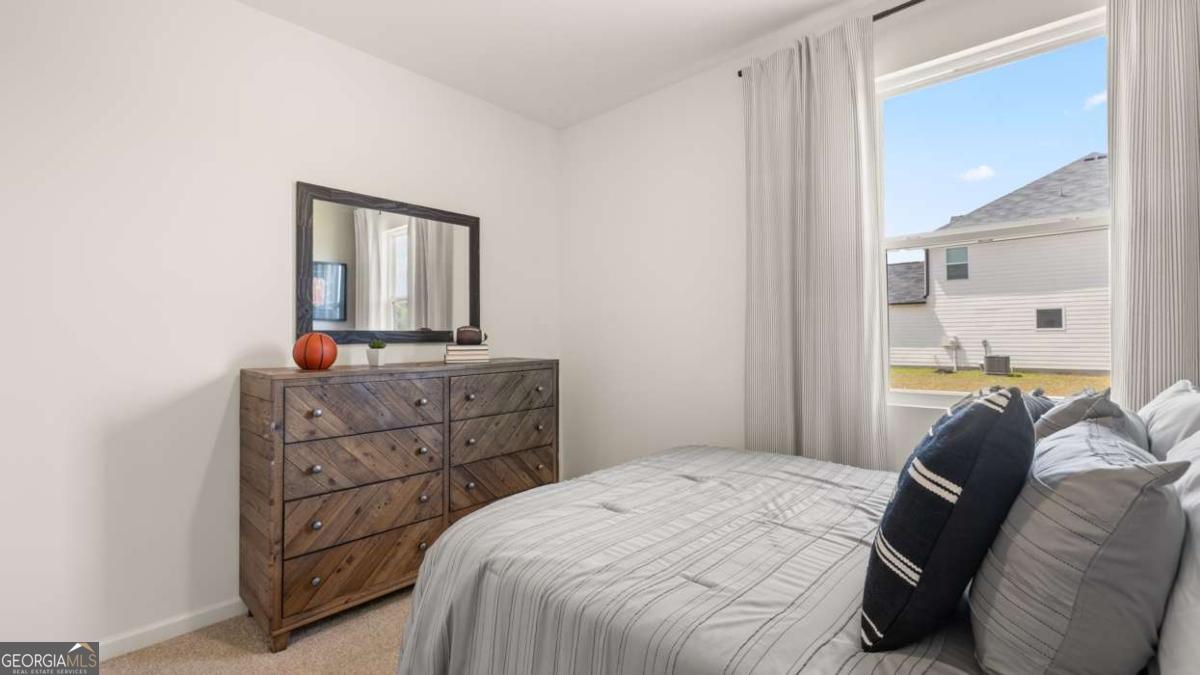 204 Cattle Drive Perry, GA 31069 - Photo 36 of 44 a bedroom with a bed and a mirror