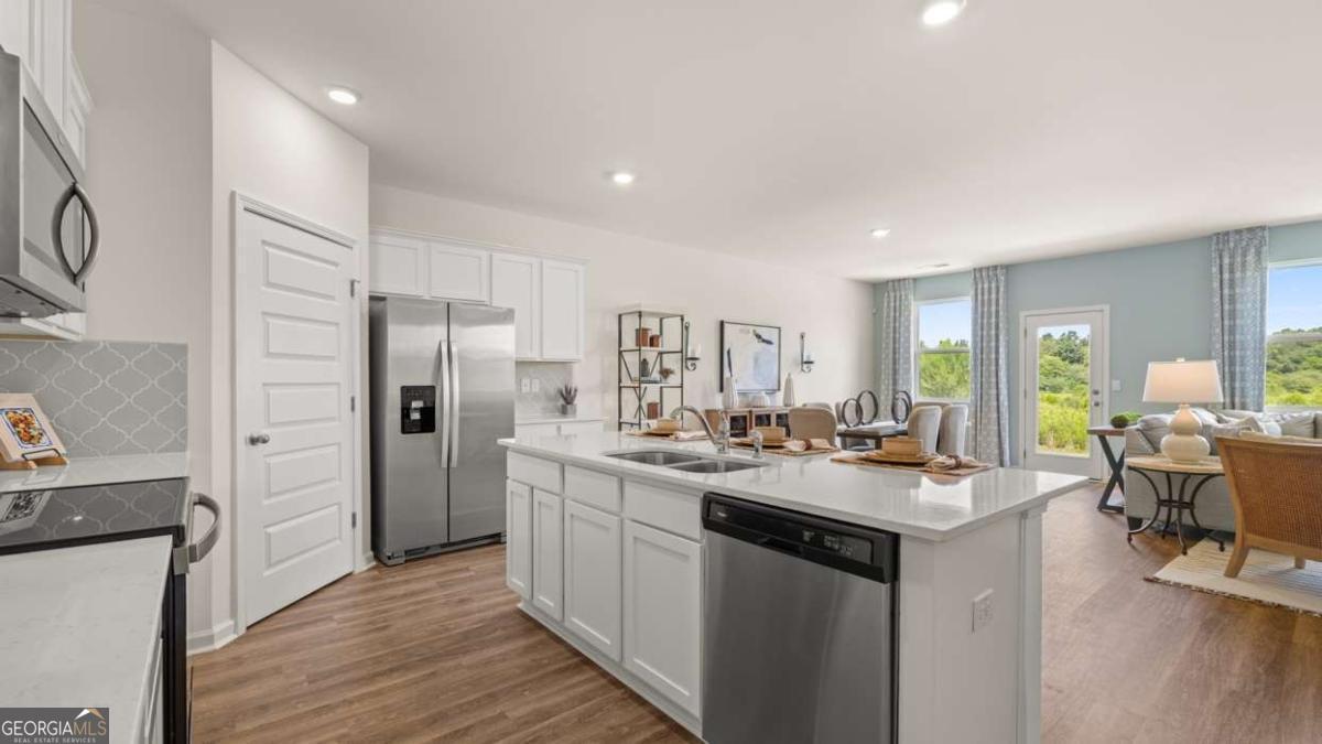 204 Cattle Drive Perry, GA 31069 - Photo 8 of 44 a kitchen with refrigerator and cabinets