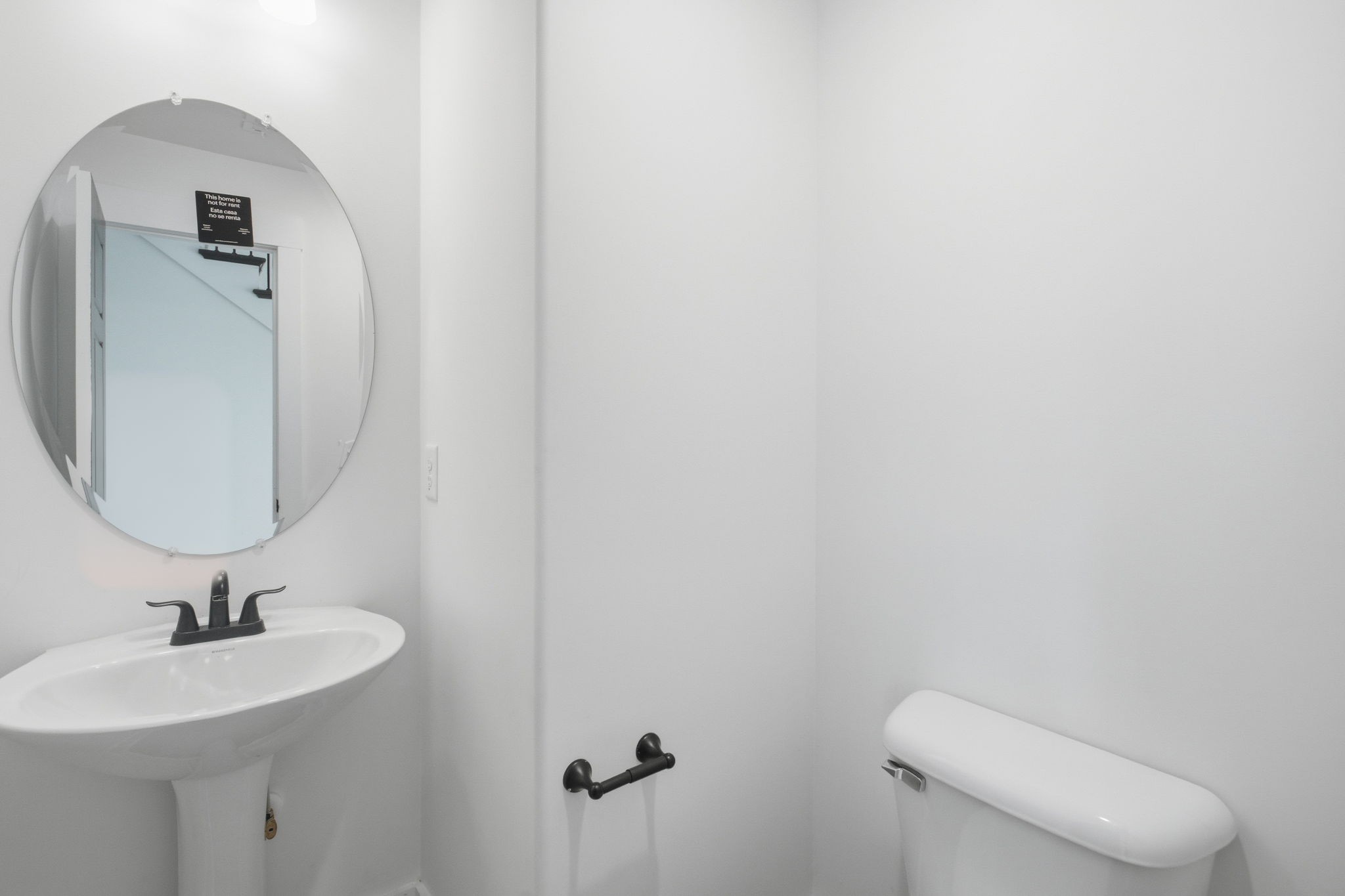 2511 Ashland City Road Clarksville, TN 37043 - Photo 17 of 31 a bathroom with a toilet sink and mirror