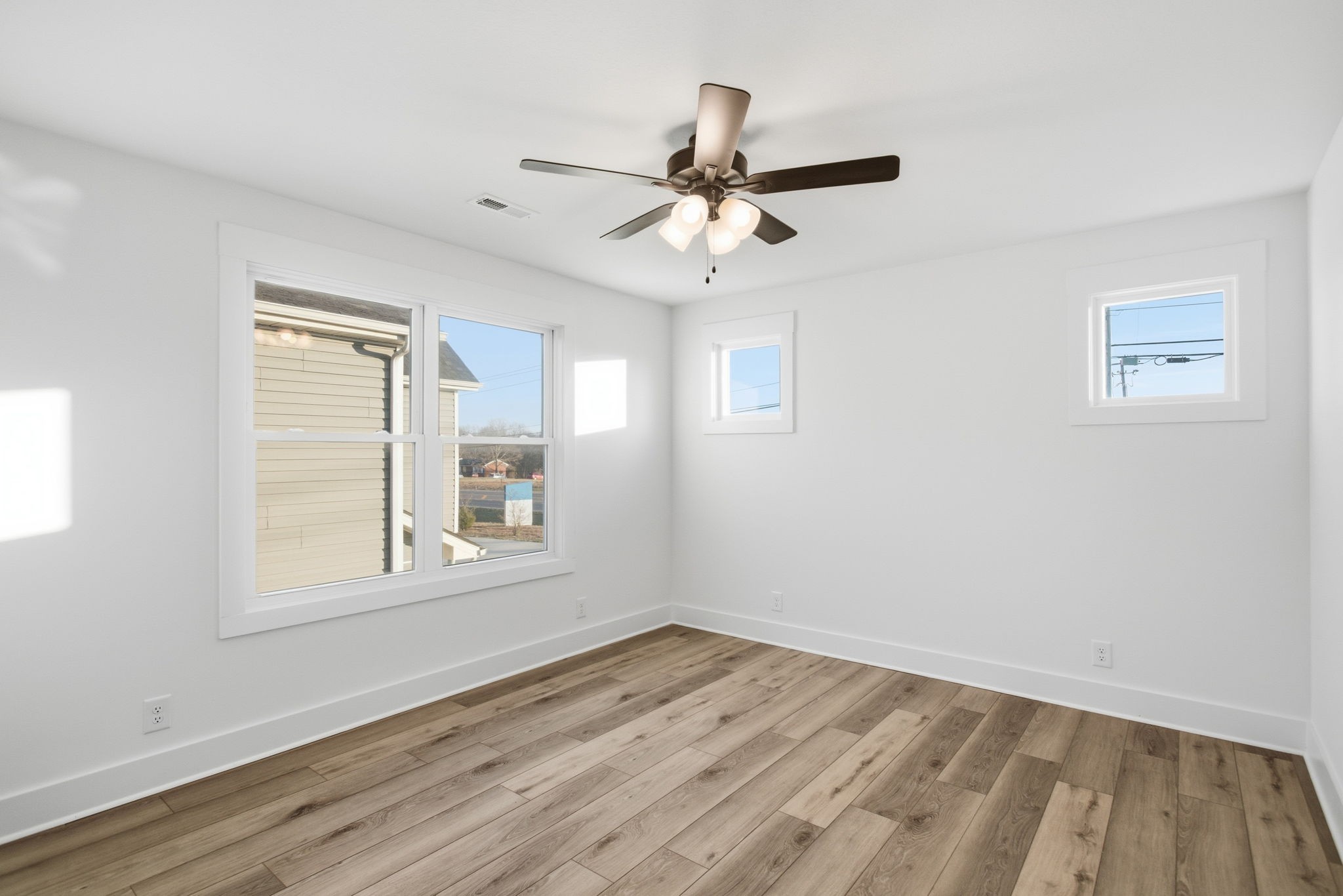 2511 Ashland City Road Clarksville, TN 37043 - Photo 22 of 31 a view of empty room with wooden floor and fan