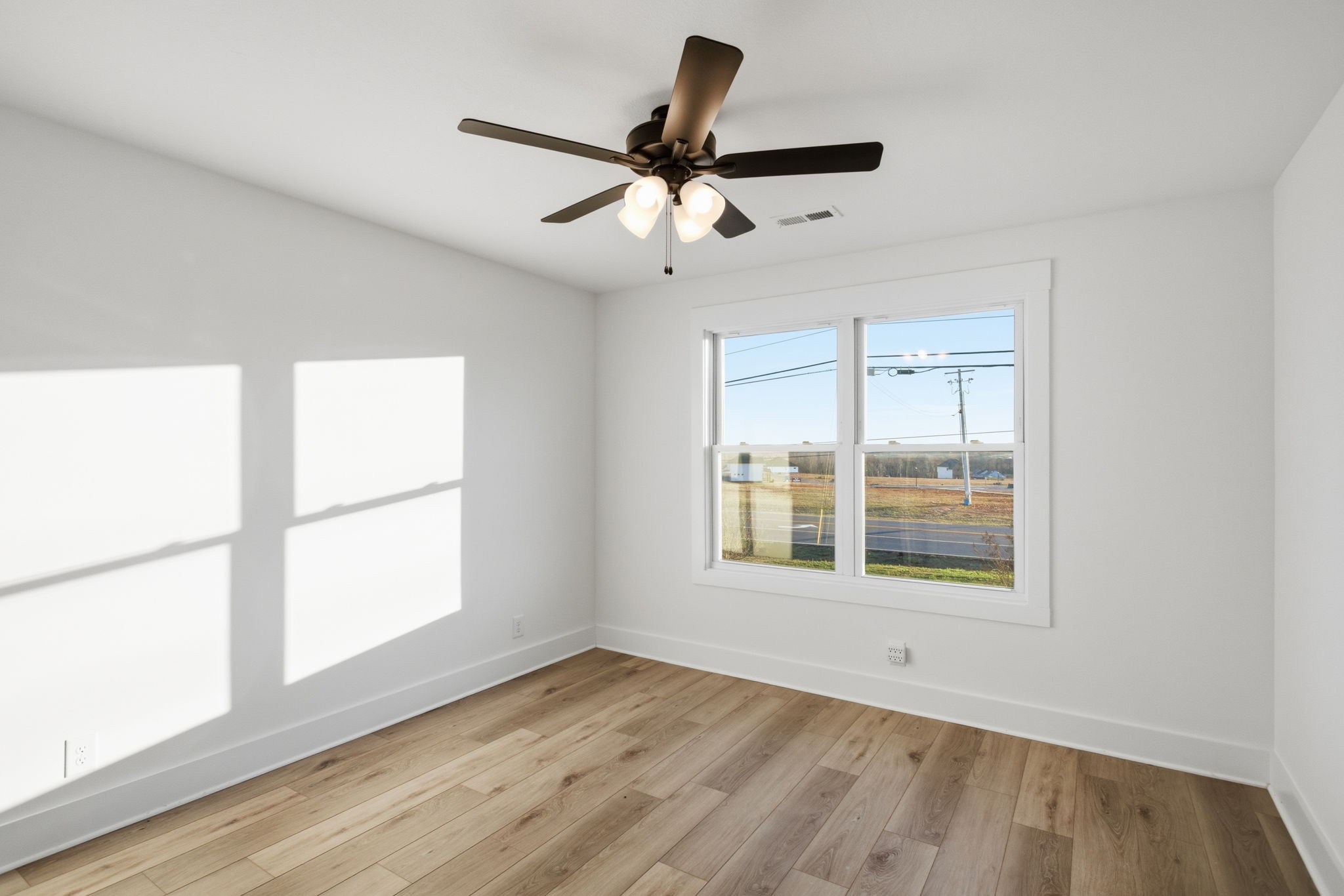 2511 Ashland City Road Clarksville, TN 37043 - Photo 24 of 31 a view of empty room with wooden floor and fan