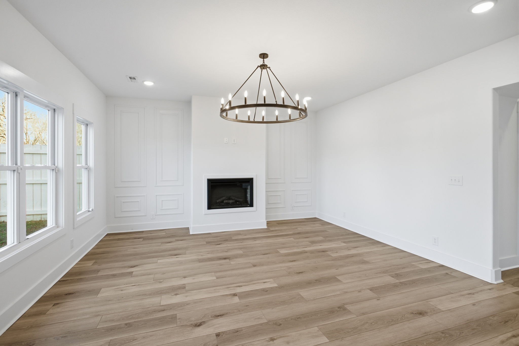 2511 Ashland City Road Clarksville, TN 37043 - Photo 5 of 31 a view of an empty room with wooden floor and a window