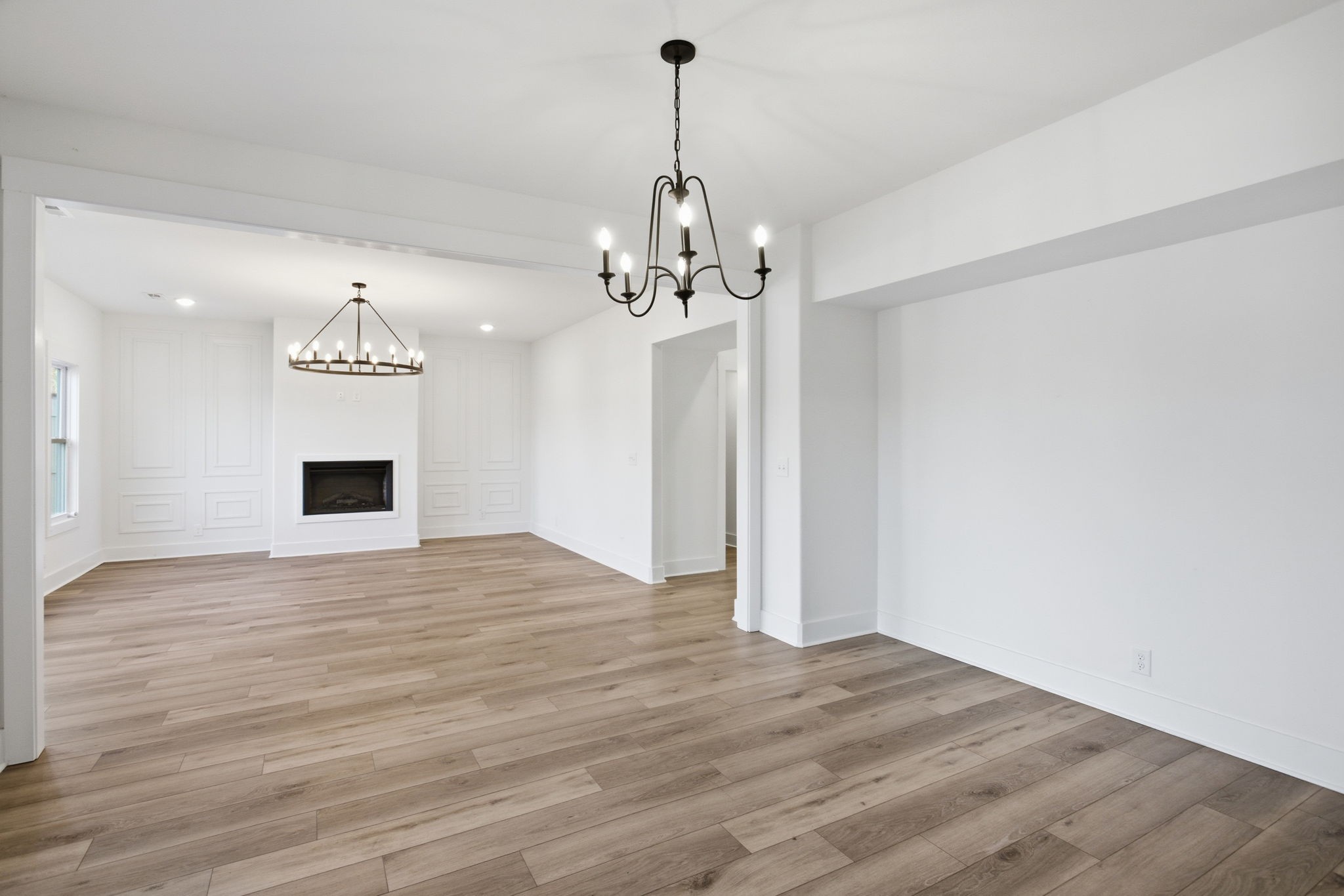 2511 Ashland City Road Clarksville, TN 37043 - Photo 9 of 31 a view of a room with wooden floor and chandelier