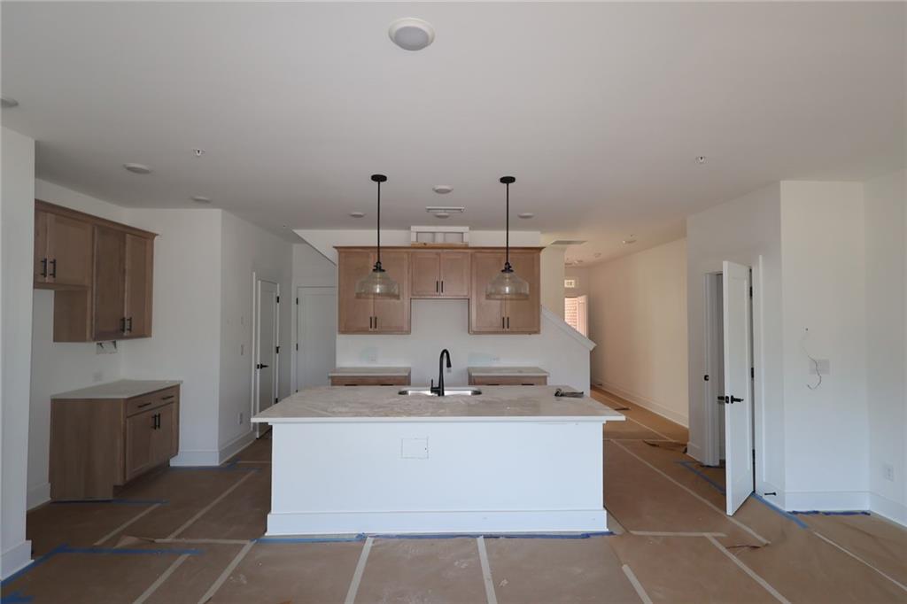 222 Redbud Road Canton, GA 30114 - Photo 7 of 10 a spacious bathroom with a sink a mirror and a shower