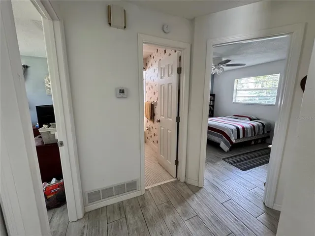 a view of a bedroom from a hallway