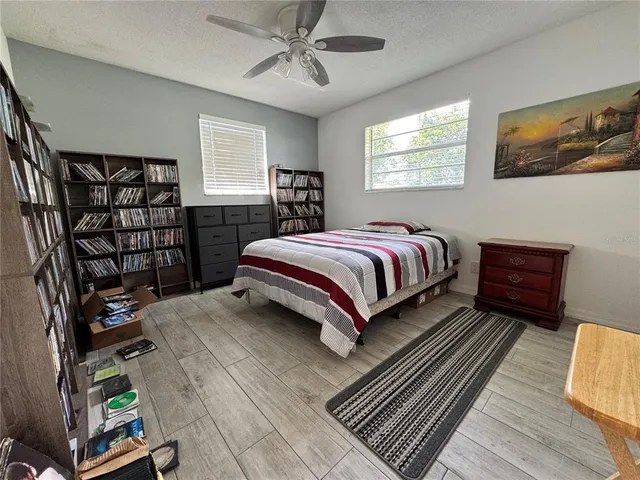 a bed room with a bed and a window
