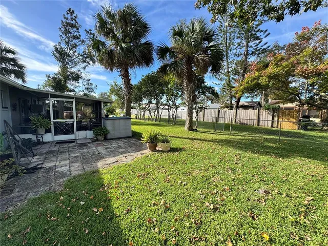 a front view of a house with a yard table and chairs