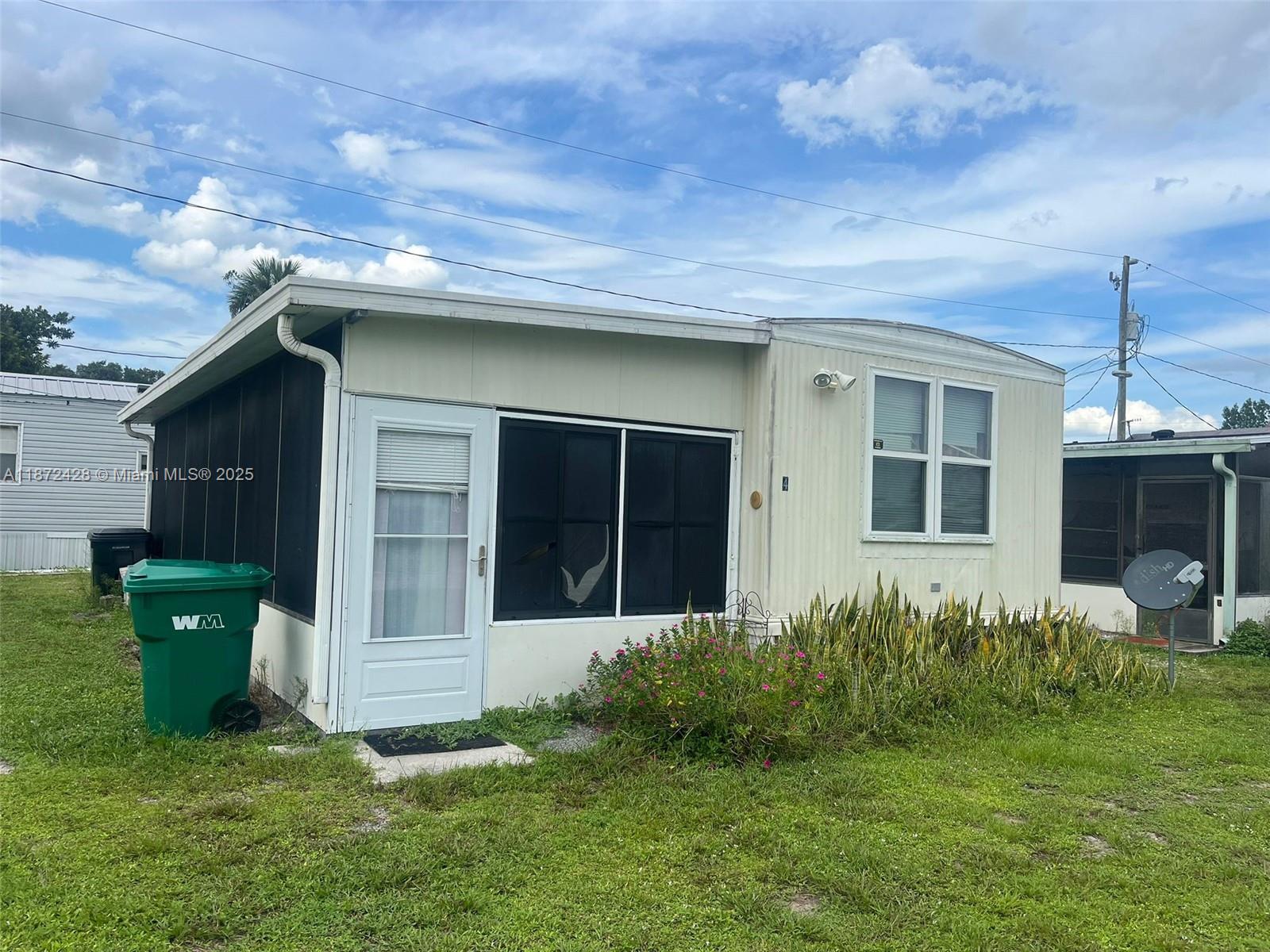 14725 Northwest 1st, Unit RV 4 Okeechobee, FL 34972 - Photo 2 of 11 a view of a house with backyard