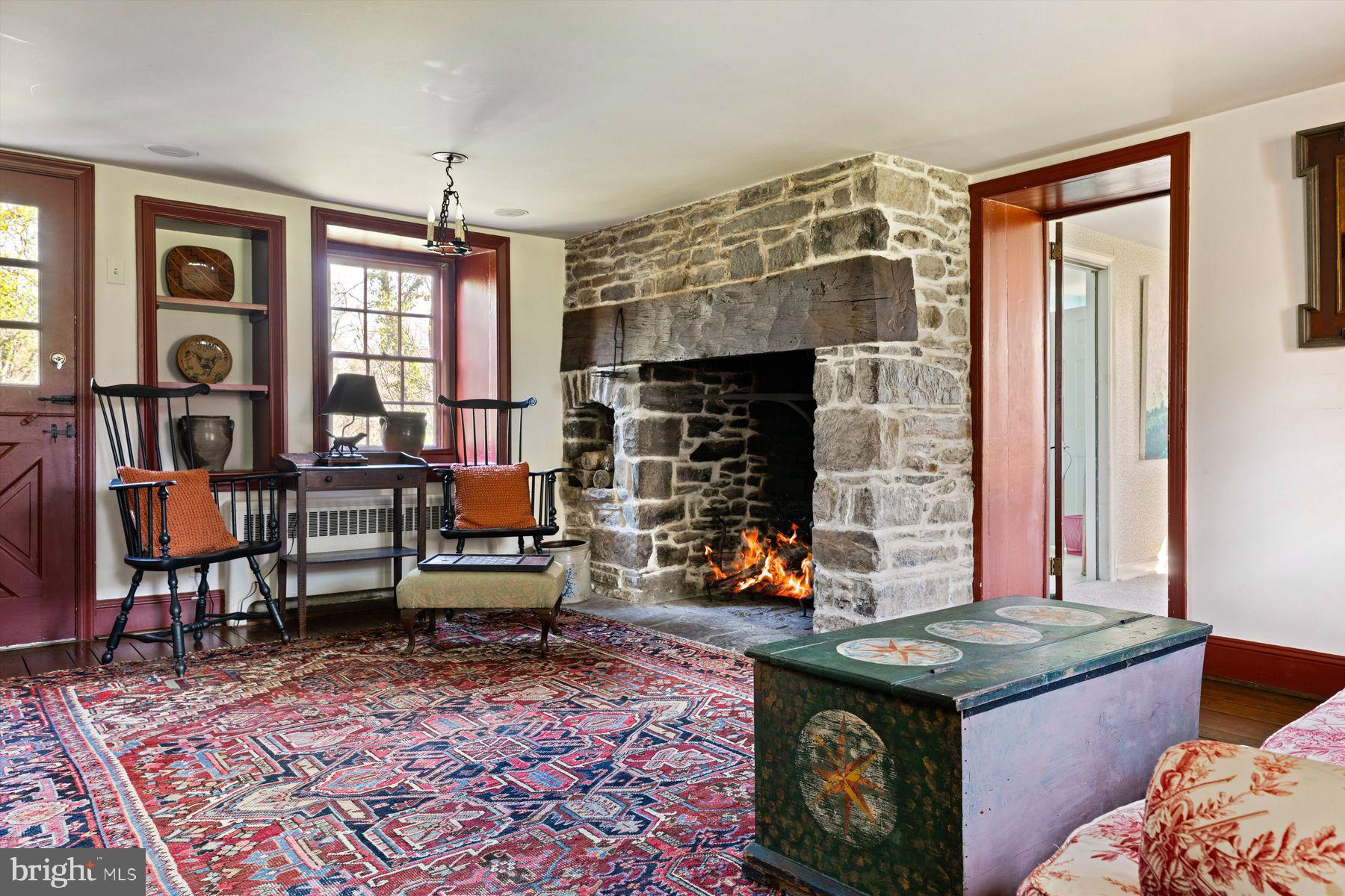 1566 Woodside Road Yardley, PA 19067 - Photo 11 of 50 a living room with furniture and a fireplace