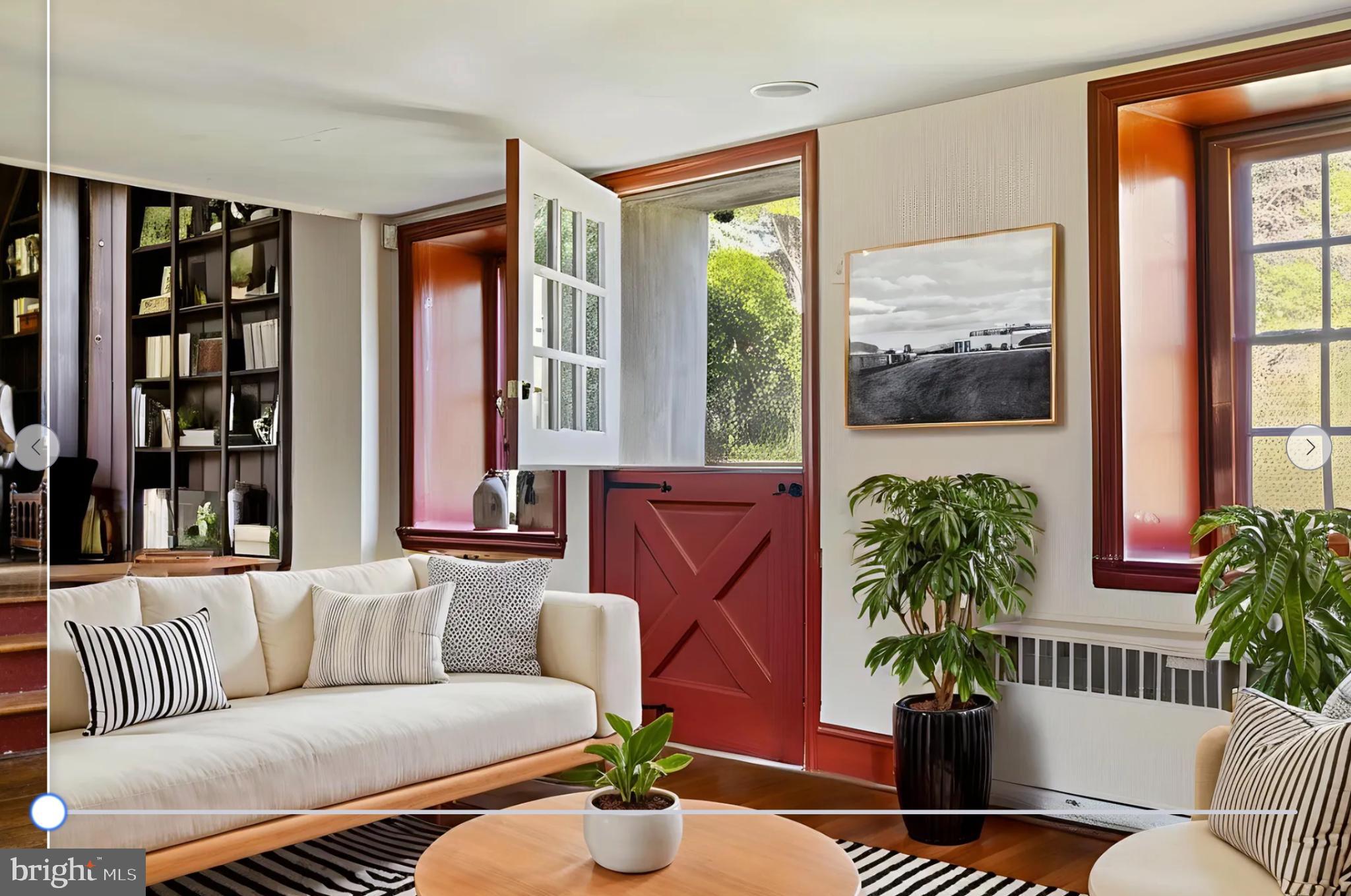 1566 Woodside Road Yardley, PA 19067 - Photo 13 of 50 a living room with furniture potted plant and a large window