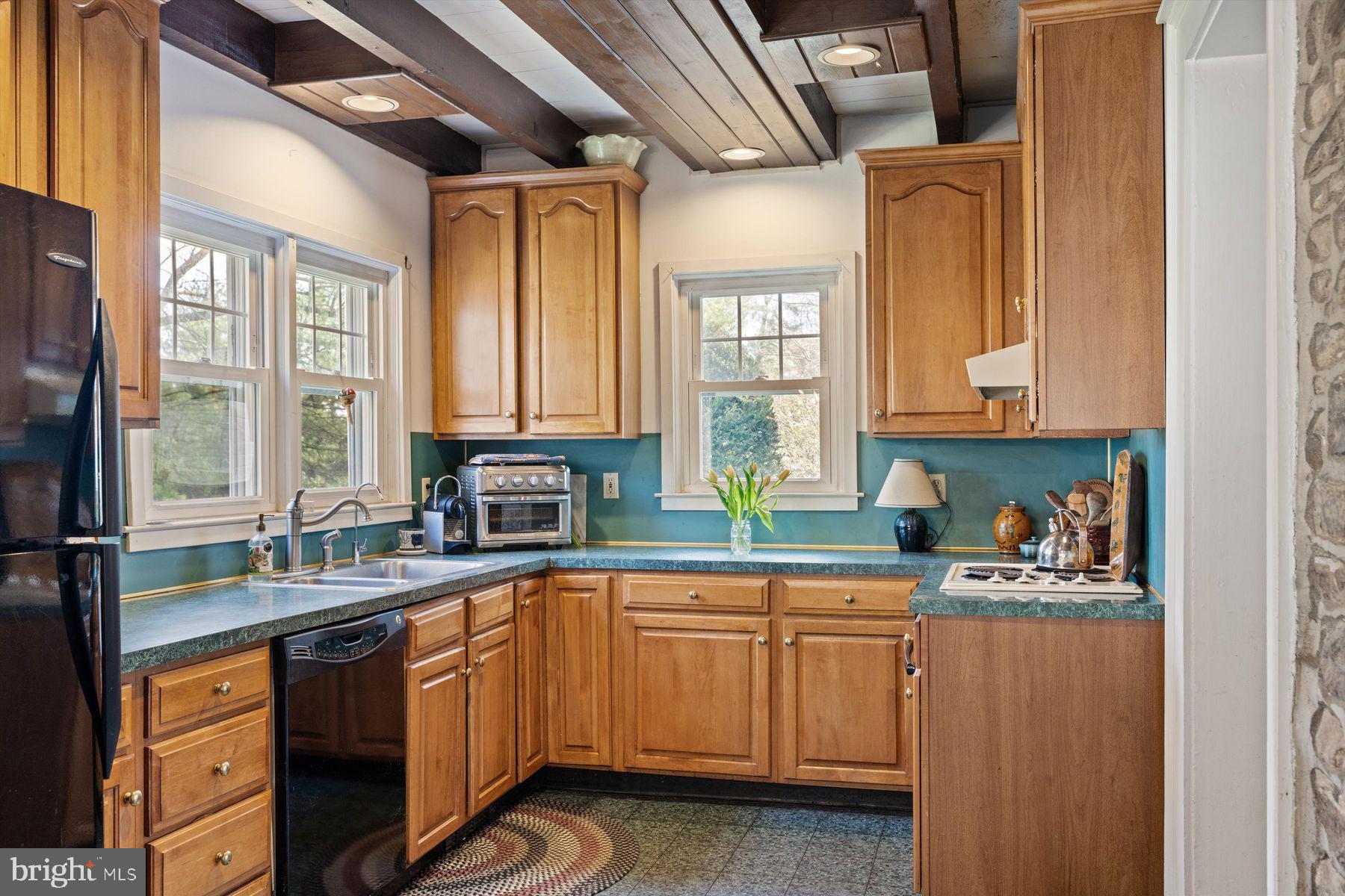 1566 Woodside Road Yardley, PA 19067 - Photo 22 of 50 a kitchen with a sink a window and cabinets