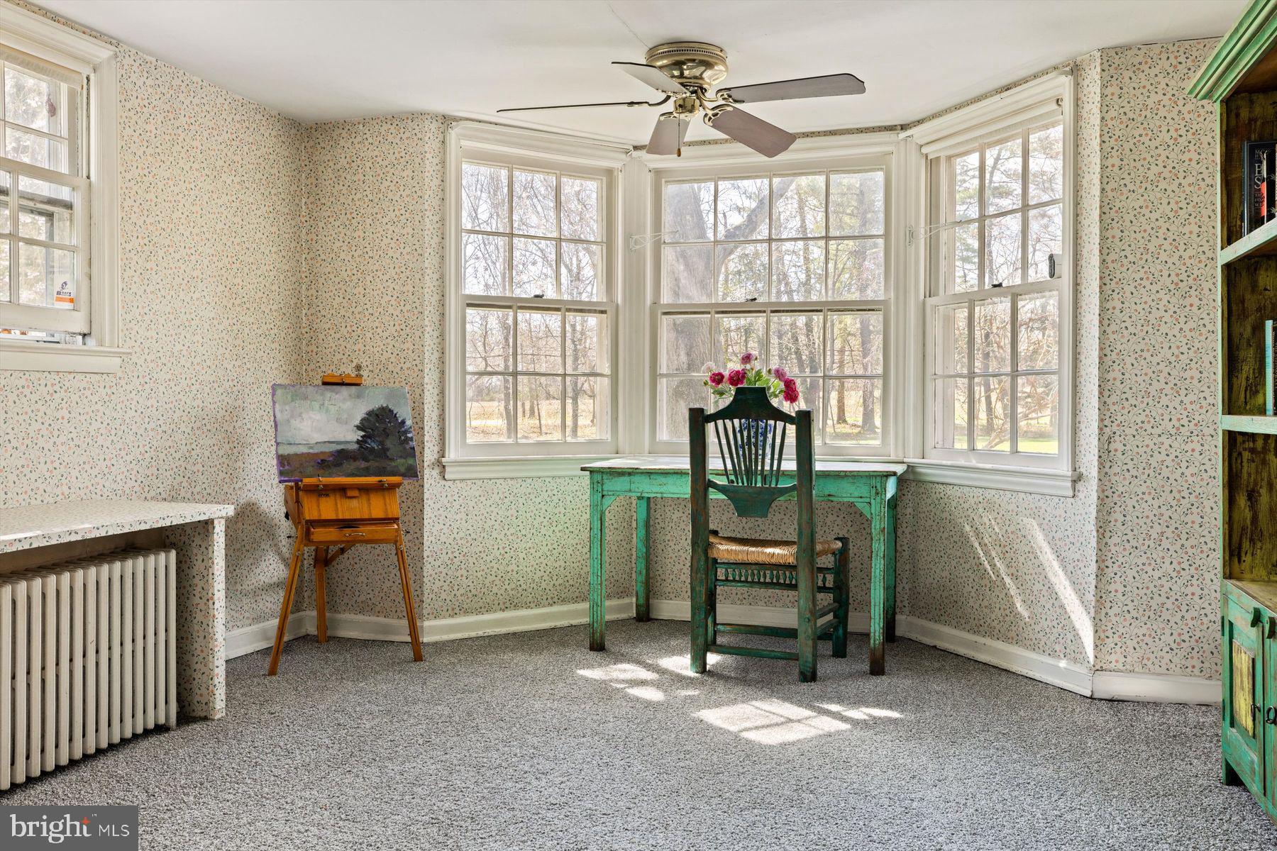 1566 Woodside Road Yardley, PA 19067 - Photo 23 of 50 a living room with furniture and a window