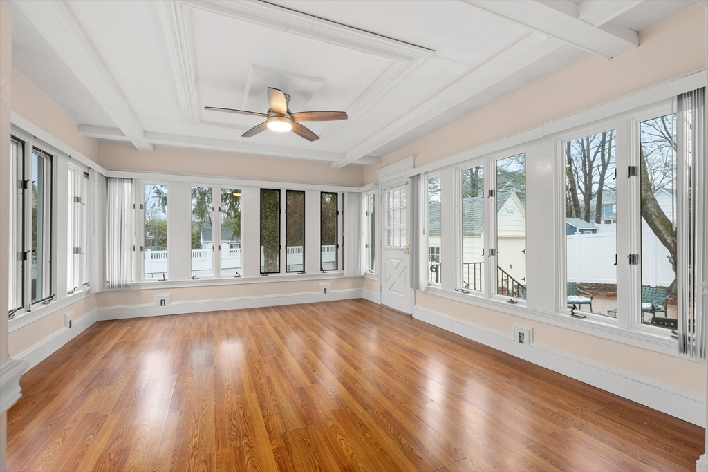 211 Cedar Street Dedham, MA 02026 - Photo 17 of 37 a view of an empty room with wooden floor and a window