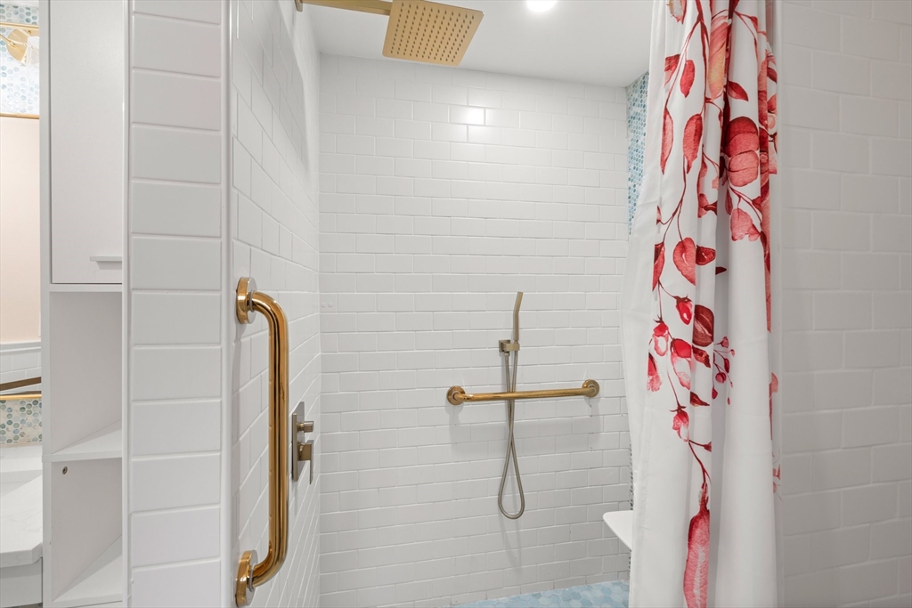 211 Cedar Street Dedham, MA 02026 - Photo 20 of 37 a bathroom with a shower and a sink