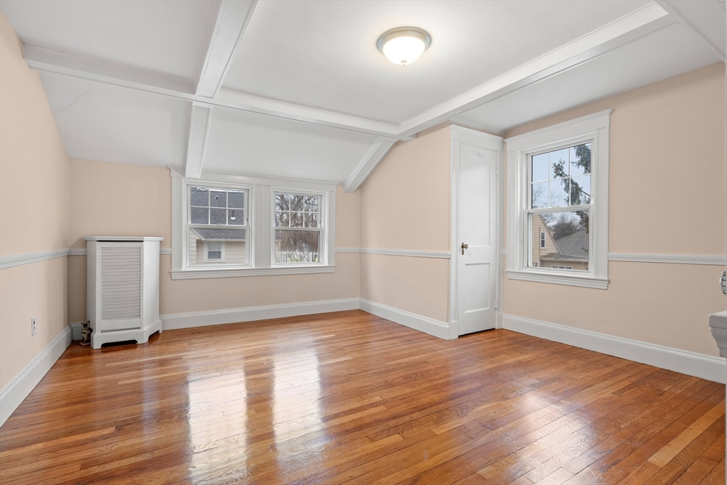 211 Cedar Street Dedham, MA 02026 - Photo 21 of 37 an empty room with wooden floor and windows
