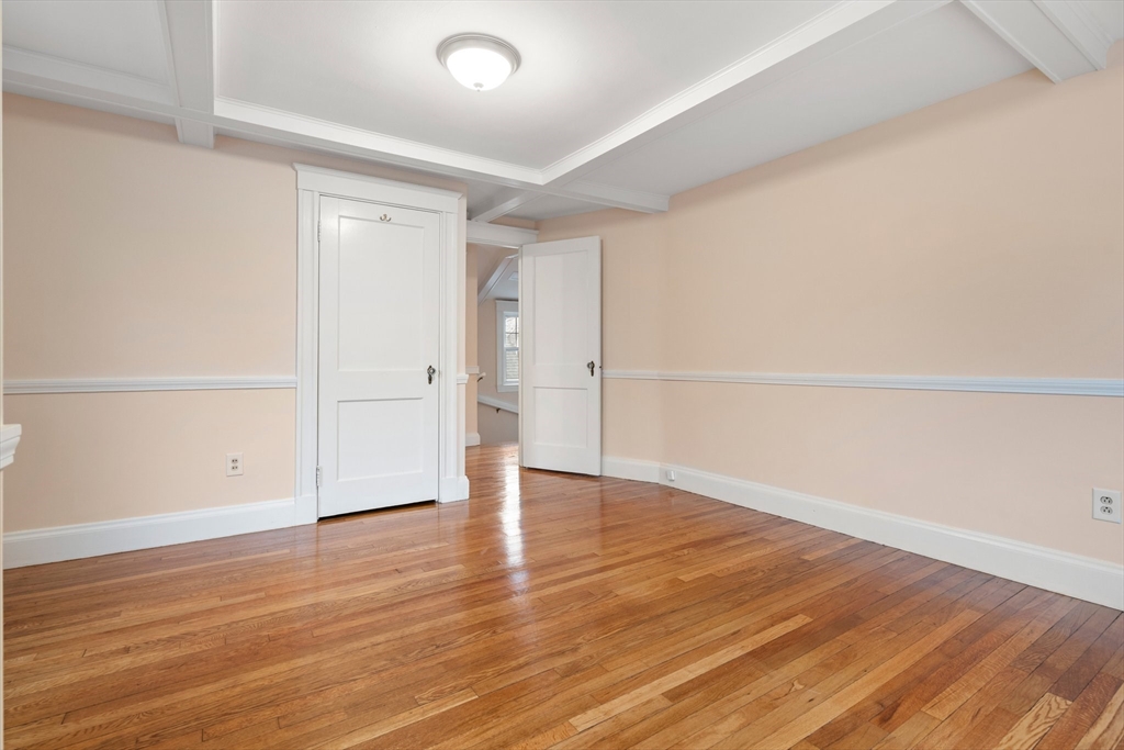 211 Cedar Street Dedham, MA 02026 - Photo 22 of 37 an empty room with wooden floor