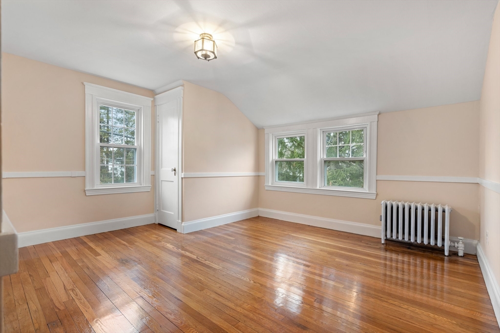 211 Cedar Street Dedham, MA 02026 - Photo 23 of 37 wooden floor in an empty room with a window