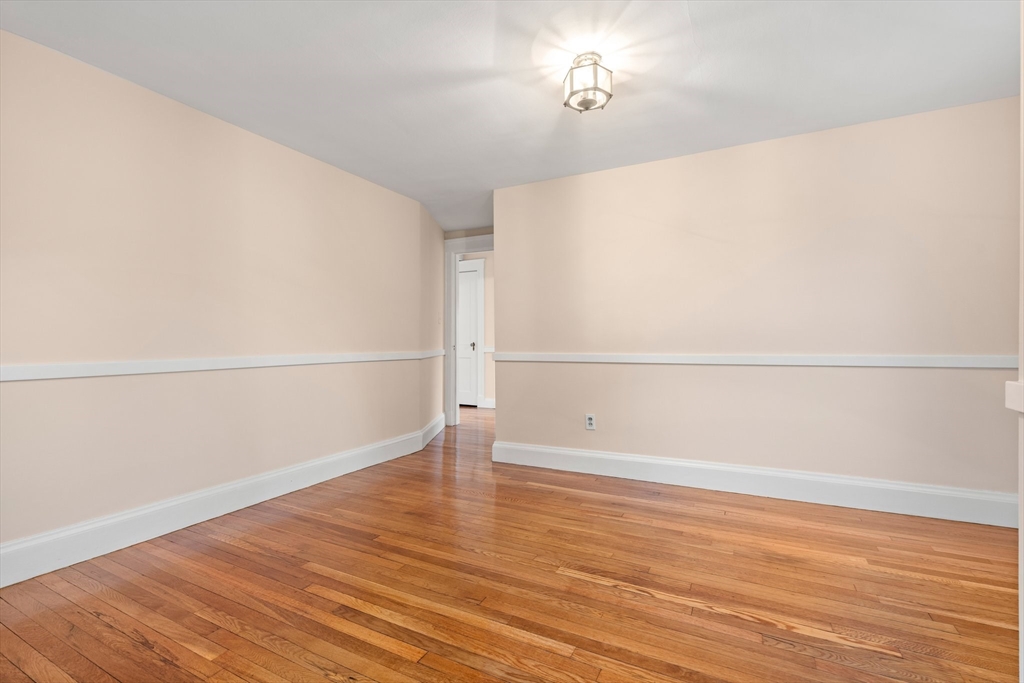 211 Cedar Street Dedham, MA 02026 - Photo 24 of 37 a view of a room with wooden floor