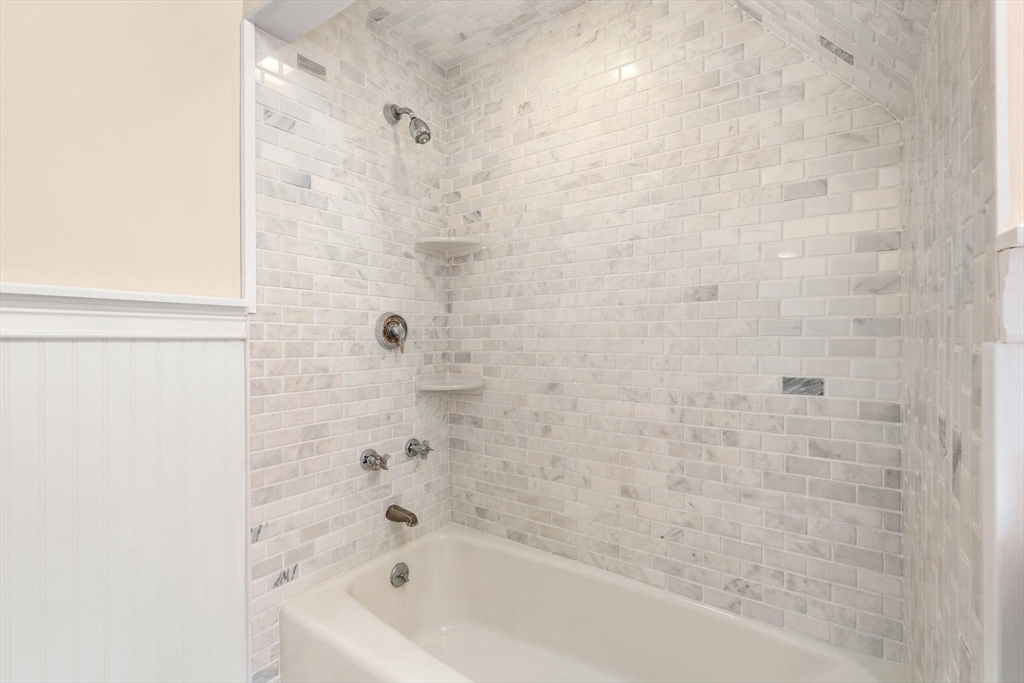 211 Cedar Street Dedham, MA 02026 - Photo 29 of 37 a bathroom with a bathtub