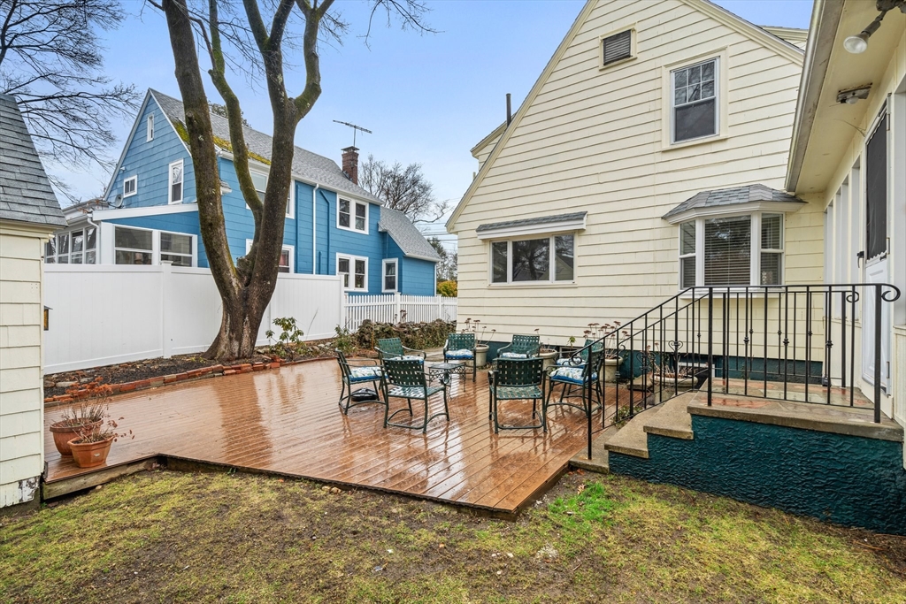 211 Cedar Street Dedham, MA 02026 - Photo 31 of 37 a view of a house with backyard and sitting area