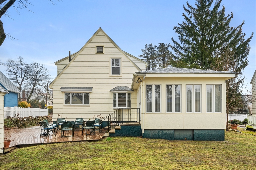 211 Cedar Street Dedham, MA 02026 - Photo 33 of 37 a front view of a house with a yard