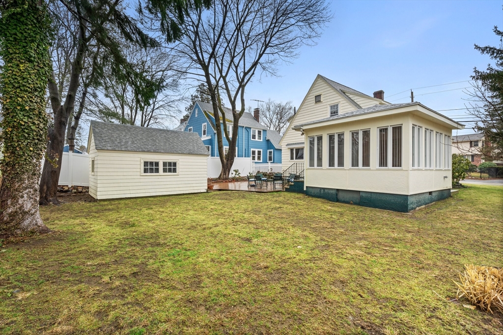 211 Cedar Street Dedham, MA 02026 - Photo 34 of 37 a house with trees in front of it