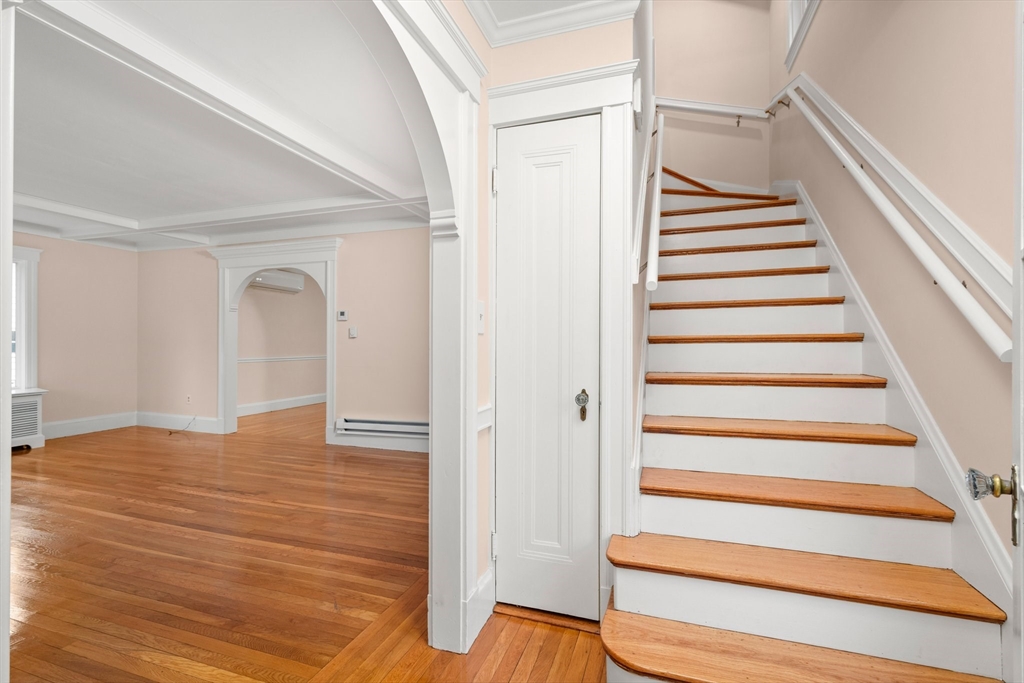 211 Cedar Street Dedham, MA 02026 - Photo 4 of 37 a view of entryway with wooden floor and stairs
