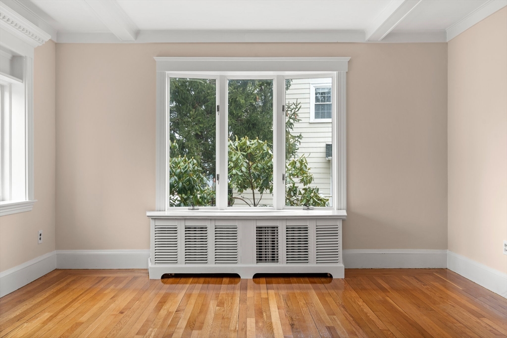 211 Cedar Street Dedham, MA 02026 - Photo 9 of 37 an empty room with wooden floor and windows