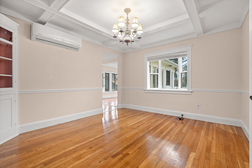 211 Cedar Street Dedham, MA 02026 - Photo 10 of 37 a view of an empty room with wooden floor and a window