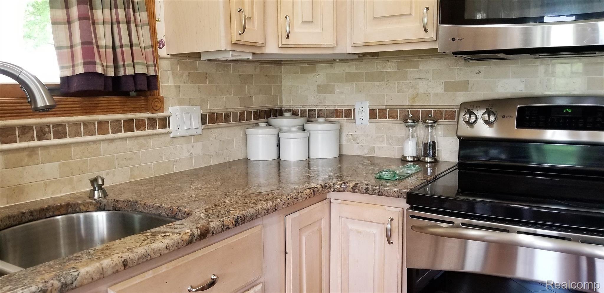 5800 Milett Road Fowlerville, MI 48836 - Photo 11 of 52 Granite Counter-tops