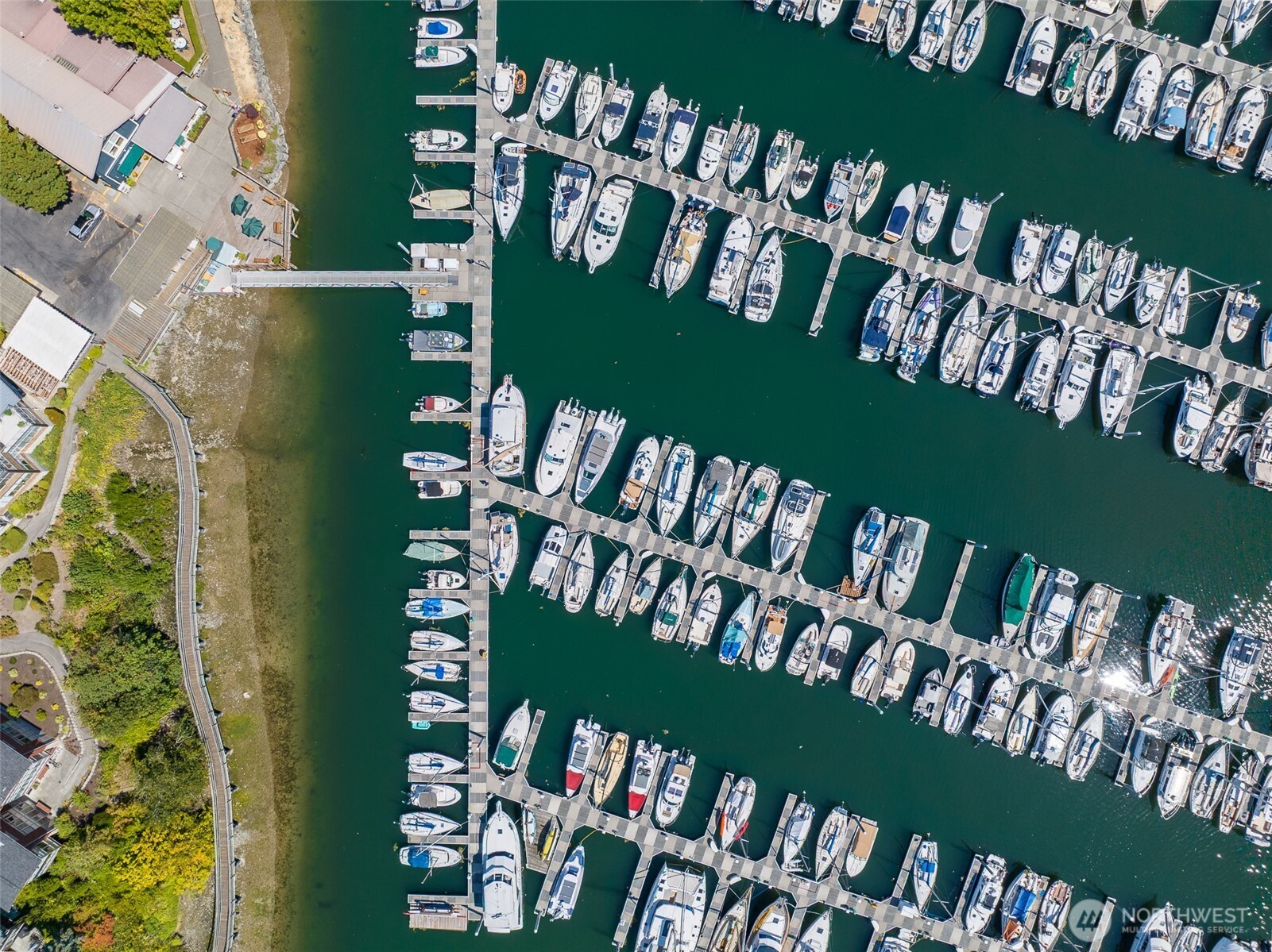 141 Parfitt Way Southwest, Unit M10 Bainbridge Island, WA 98110 - Photo 11 of 23 a view of a wooden bench