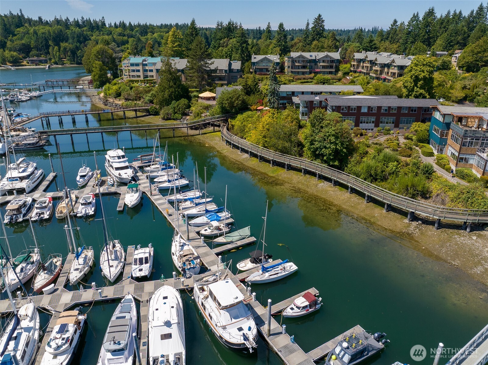 141 Parfitt Way Southwest, Unit M10 Bainbridge Island, WA 98110 - Photo 4 of 23 an aerial view of a house with a lake view
