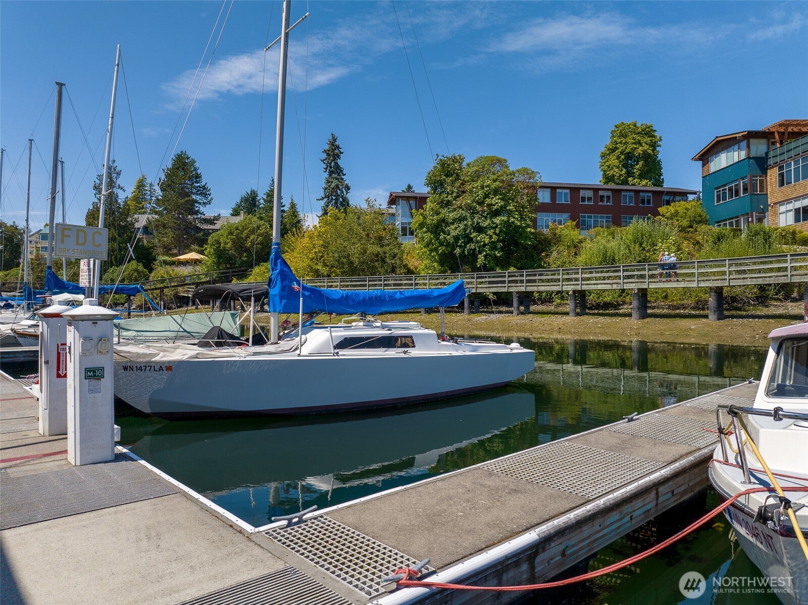141 Parfitt Way Southwest, Unit M10 Bainbridge Island, WA 98110 - Photo 8 of 23 a view of a swimming pool with a yard and sitting area
