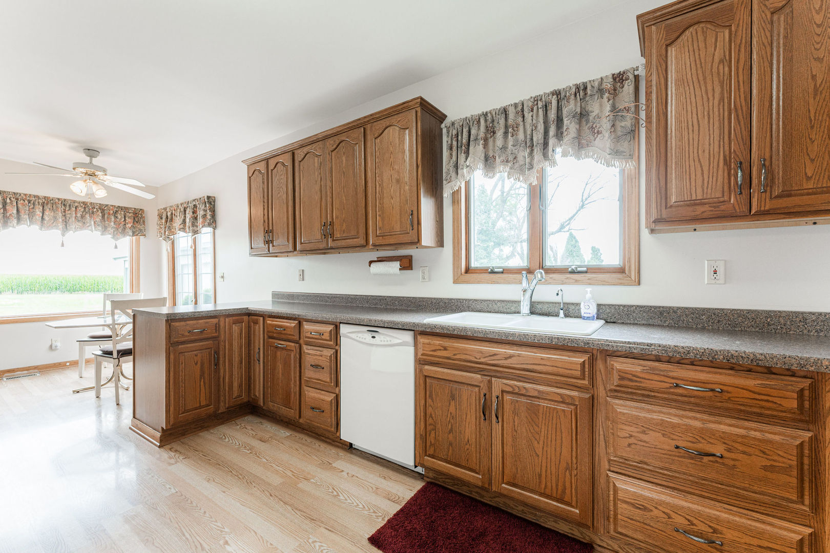 3877 Rich Road Malta, IL 60150 - Photo 11 of 43 a kitchen with sink cabinets and window