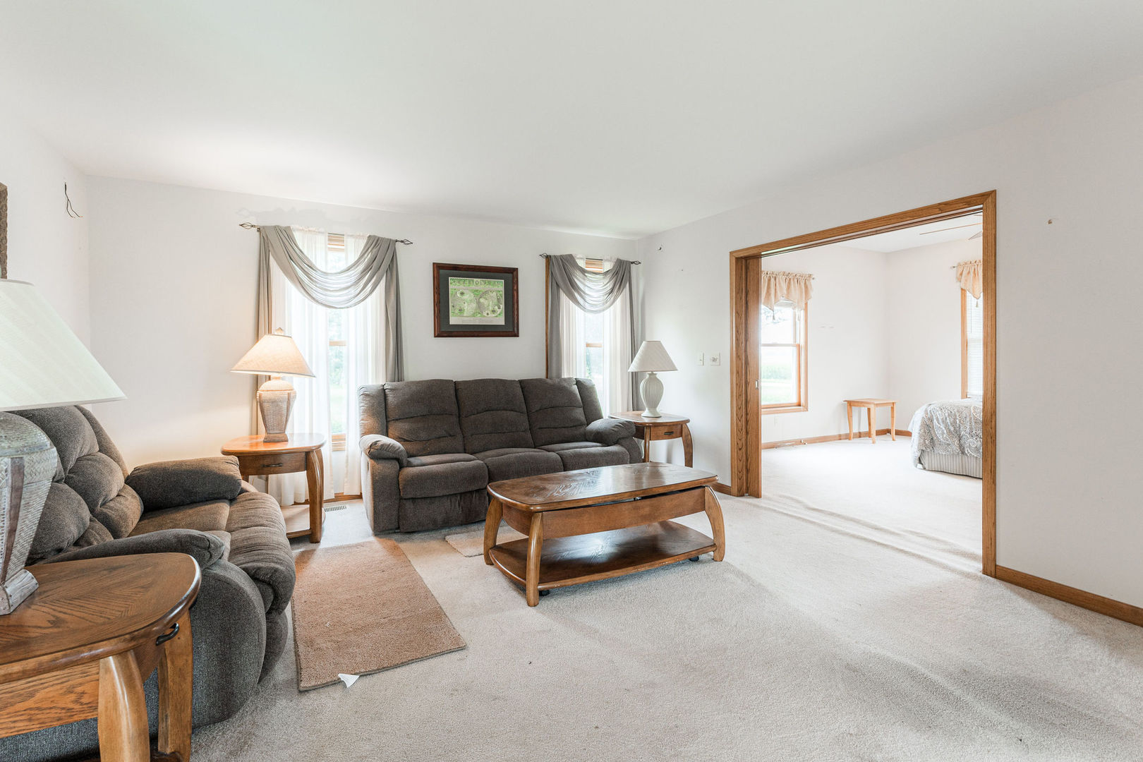 3877 Rich Road Malta, IL 60150 - Photo 17 of 43 a living room with furniture and a large window