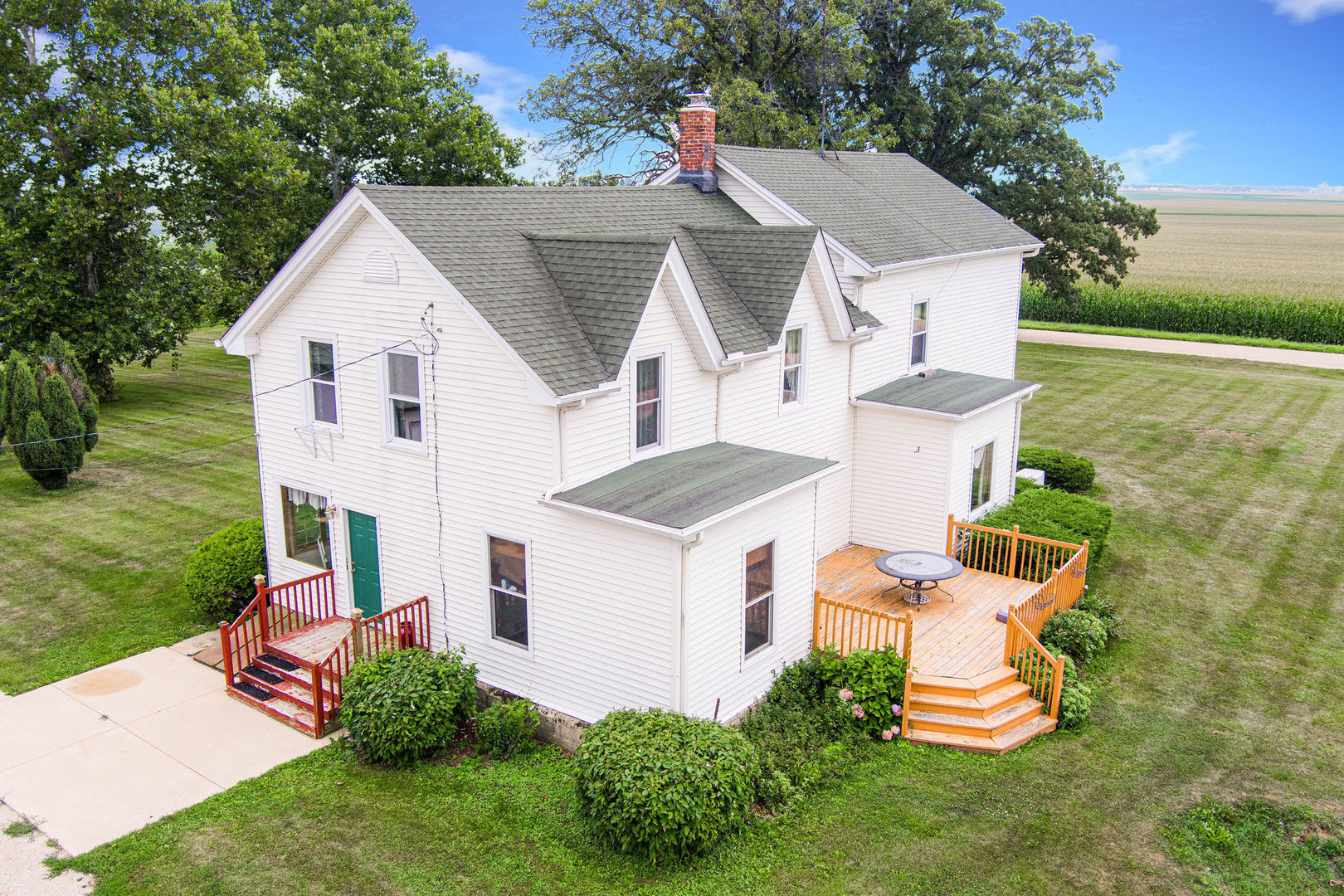 3877 Rich Road Malta, IL 60150 - Photo 4 of 43 a aerial view of a house with a yard and potted plants
