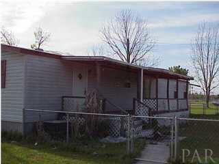1731 Jacks Branch Road Cantonment, FL 32533 - Photo 1 of 2 a view of house with backyard and trees