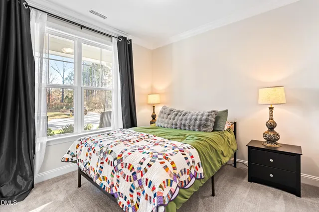 a kitchen with a dining table chairs and wooden floor