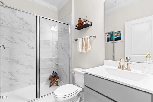 a kitchen with kitchen island a dining table chairs and white cabinets