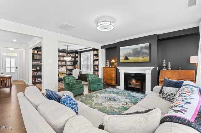 a dining room with furniture and a book shelf