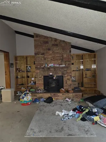 a room with furniture and gym equipment