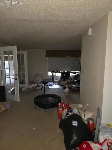 a kitchen with kitchen island granite countertop a sink stove and cabinets