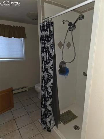 a bed room with furniture and a window