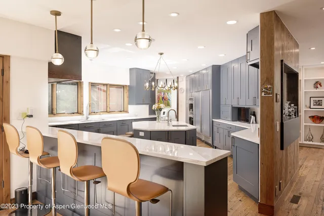 a view of a dining room with a table and chairs